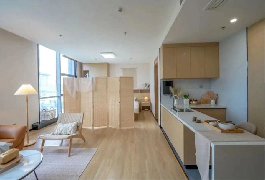 yantai-weiran-modern-light-wood-tone-studio-apartments-design-with-open-kitchen.webp